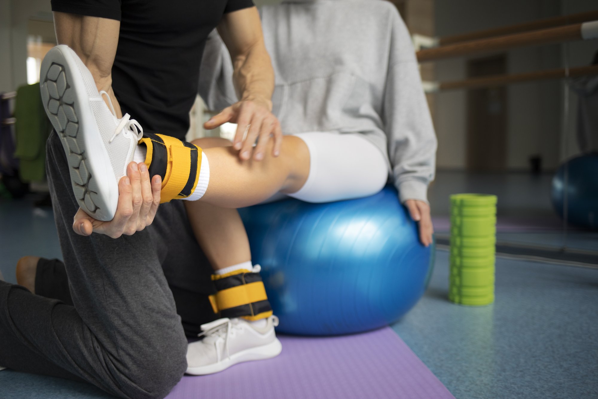 patient-doing-physical-rehabilitation-helped-by-therapists